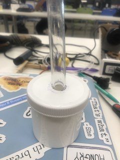 Lid with first tube